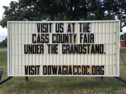 Our sign on the street says, VISIT US AT THE CASS COUNTY FAIR UNDER THE GRANDSTAND.