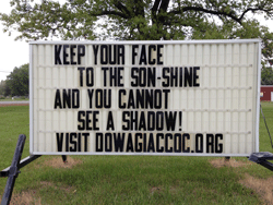 Our street signs says, Keep your face to the son-shine and you cannot see a shadow.