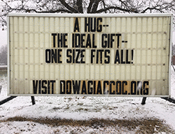 Our sign on the street says, A HUG--THE IDEAL GIFT--ONE SIZE FITS ALL.