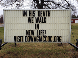 Our sign on the street says, IN HIS DEATH WE WALK IN NEW LIFE!